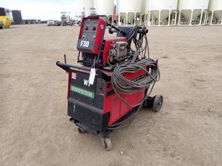 Lincoln Electric Power Wave 455 208/230/460/575V 3-Phase Welder. SN U1010121038 c/w Cable, Cart And Lincoln Electric Dual Wire Feed. SN U1010226252 **THIS ITEM IS LOCATED @ 5107 67 ST, LLOYDMINSTER, AB FOR MORE INFO CONTACT JASON  @780-870-0193**