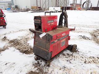 Lincoln Electric Power Wave 455M/STT Advanced Process Welder. SN U10601525W83 c/w Lincoln Electric Power Feed 25M Wire Feeder. SN U1060801378 *Note: Working Condition Unknown, Damage On Wire Feeder* **THIS ITEM IS LOCATED @ 5107 67 ST, LLOYDMINSTER, AB FOR MORE INFO CONTACT JASON  @780-870-0193**