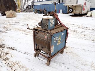 Miller Dimension 302 230/460/575V 3-Phase CC/CV DC Welding Power Source. SN KH462529 c/w Miller 60 Series 24V Wire Feeder. SN KH303811 **THIS ITEM IS LOCATED @ 5107 67 ST, LLOYDMINSTER, AB FOR MORE INFO CONTACT JASON  @780-870-0193**