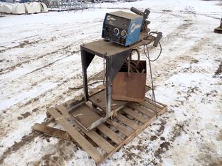 Miller 24V Wire Feeder c/w Oxy/Acetylene Hose And Stand. SN ME040197V *Note: Working Condition Unknown* **THIS ITEM IS LOCATED @ 5107 67 ST, LLOYDMINSTER, AB FOR MORE INFO CONTACT JASON  @780-870-0193**