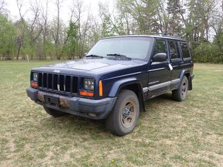 2001 Jeep Grand Cherokee Sport 4X4 SUV c/w 4L, 6-Cyl, A/T And 215/75R15 Tires. Showing 369,256kms. VIN 1J4FF48S41L598982 *Note: Windshield Cracked, Rust* **Located In Edmonton**