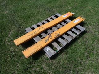 (2) 6ft Skid Steer Fork Extensions *Note: Dents In Extensions* **Located In Edmonton**