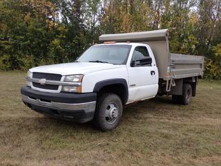 2003 Chevrolet Silverado 3500 4X2 Dump Truck c/w 6.0L V8 Vortec, A/T, 5171kg GVWR, 2118kg Fronts, 3878kg Rears, Eloquip 11ft X 7 1/2ft Aluminum Dump Box, Manual Tarp And LT215/85R16 Tires. Showing 342,931kms. VIN 1GBJC34U53E133875 *Note: Hole In Driver Seat, Windshield Cracked* **Located In Edmonton**