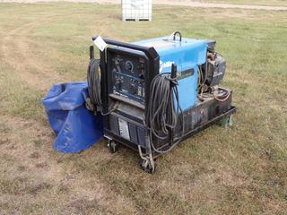 Miller Bobcat 225G 120/240V Single Phase CC/CV AC/DC 8000W Welding And Power Generator c/w Onan P216/P220 Gas Engine And Cables. Showing 583hrs. SN KG044347  **Located In Edmonton**