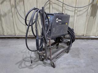Miller Super S-32P 100V Wire Feeder w/ Stand, Ground Cable, Stinger And Helmet. SN KH353205 *Note: Working Condition Unknown*