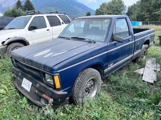 1992 Chevrolet S-10 Regular Cab 4X2 Pickup C/w 4.3L V6, A/T, 215/65R15 Showing 267,372 Kms *Non Running, No Keys* VIN 1GCCS14Z9N2116427 *Located In Fernie, BC*