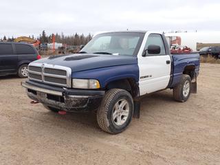 1996 Dodge Ram 1500 4X4 Regular Cab Pickup c/w 5.2L V8 Magnum, 5-Spd Manual And LT265/70R17 Tires. Showing 331,528kms. VIN 1B7HF16Y9TJ196250 *Note: Dent In Rear Bumper, Minor Rust* **Located In Fort McMurray**