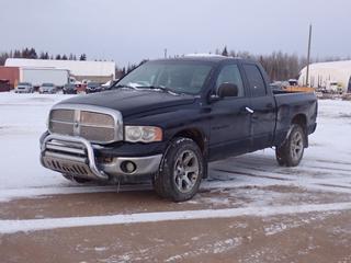 2002 Dodge Ram 1500 4X4 Quad Cab Pickup c/w 4.7L V8 Magnum, A/T And P275/60R20 Tires. Showing 191,778kms. VIN 1D7HU18N42J184455 *Note: Manifold Leaking, Windshield Cracked, Passenger Side Doors Dented, Rust Spots, Dents In Drivers Side Box, Rust On Tailgate, Engine Light On* **Located In Fort McMurray**