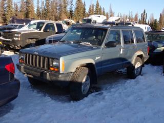 1998 Jeep Grand Cherokee Sport 4X4 SUV c/w 4L, 6-Cyl A/T And 235/75R15 Tires. VIN 1J4FJ68S6WL231308 *Note: Windshield Cracked, Rust Throughout Body, Radio Missing, No Key, Running Condition Unknown, Buyer Responsible For Removal* **Located In Fort McMurray**