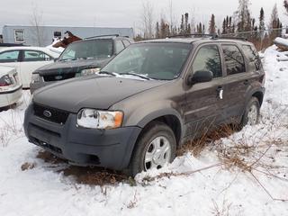 2003 Ford Escape XLT SUV c/w 3.0L, A/T, Power Sunroof And P235/70R16 Tires. VIN 1FMYU93153KC02465 *Note: Rust Around Wheel Well, Headlight Broken, No Battery, No Key, Running Condition Unknown, Buyer Responsible For Removal* **Located In Fort McMurray**