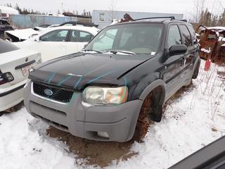 2001 Ford Escape XLT 4X4 SUV c/w 3.0L, A/T. Showing 230,757kms. VIN 1FMYU04141KA78650 *Note: Engine Runs, No Tires, Buyer Responsible For Removal* **Located In Fort McMurray**