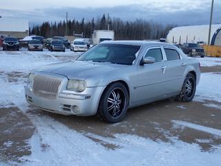 2005 Chrysler J300C 4-Door Sedan c/w 5.7L Hemi, A/T, Power Sunroof And 275/45ZR20 Tires. Showing 258,929kms. VIN 2C3AA63H55H148299 *Note: Windshield Cracked, Rust, Engine, ABS And Battery Light On* **Located In Fort McMurray**