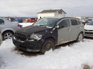 2009 Dodge Caliber SXT SUV c/w 2.0L, A/T And 215/50R17 Tires. Showing 185,872kms. VIN 1B3HB48A79D106468 *Note: Back Bumper Damaged, Headlight Broken, Fender Damaged, Windshield Cracked, No Key, Running Condition Unknown, Buyer Responsible For Removal* **Located In Fort McMurray**