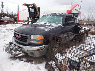 2004 GMC Sierra 3500 4X4 Flat Deck Truck c/w 6.6L Turbo Duramax Diesel, A/T, 11,400lb GVWR, 8 1/2ft X 8ft Deck And LT215/85R16 Tires. VIN 1GTJK34144E136028 *Note: Center Console Disassembled, Door  Handles Broken, No Key For Ignition, Running Condition Unknown, Buyer Responsible For Removal* **Located In Fort McMurray**