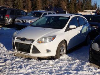 2012 Ford Focus 4-Door Sedan c/w 2.0L, 4-Cyl, A/T And 215/65R16 Tires. Showing 275,389kms. VIN 1FAHP3K23CL458705 *Note: Minor Rust, Windshield Cracked, Steering Column Damaged, No Key, Running Condition Unknown, Buyer Responsible For Removal* **Located In Fort McMurray**