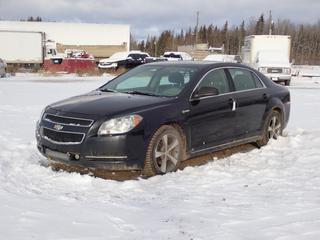2009 Chevrolet Malibu Hybrid 4-Door Sedan c/w 2.4L, A/T, Power Sunroof And 215/55R17 Tires. Showing 242,485kms. VIN 1G1ZF57549F245276 *Note: Windshield Cracked, Traction Control Light On, Rust Spots* **Located In Fort McMurray**