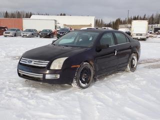 2007 Ford Fusion 4-Door Sedan c/w 3.0L, A/T And 225/50R17 Tires. Showing 205,848kms. VIN 3FAHP02117R139638 *Note: Rust Spots* **Located In Fort McMurray**