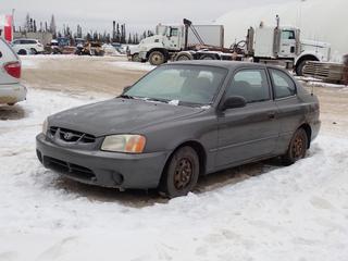 2002 Hyundai Accent GS 2-Door Sedan c/w 1.5L, A/T And 155/80R13 Tires. Showing 211,943kms. VIN KMHCG35G82U160098 *Note: Windshield Cracked, Rust Throughout Body, Dent In Passenger Side Fender, No Key, Running Condition Unknown, Buyer Responsible For Removal* **Located In Fort McMurray**