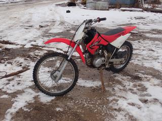 2006 Honda CRF100F Motorcycle c/w 70/100-19 Front And 90/100-16 Rear Tires. VIN JH2HE032X6K300022 *Note: No Key, Running Condition Unknown, Buyer Responsible For Removal* **Located In Fort McMurray**