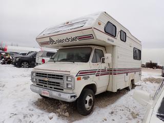 1985 Chevrolet Chevy Van 30 Glendale  CMH 200 13ft Motorhome c/w V8, A/T, 4370kg GVWR And 8.00R16.5 Tires. Showing 110,477kms. VIN 2GBGG31M6F4152605 *Note: Does Not Start, Running Condition Unknown, Windshield Cracked, Buyer Responsible For Removal* **Located In Fort McMurray**