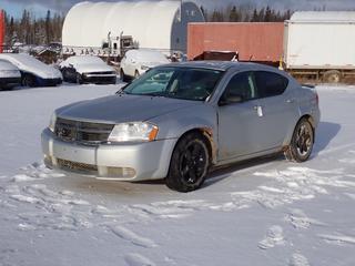 2010 Dodge Avenger 4-Door Sedan c/w 2.4L, A/T And 225/65R17 Tires. Showing 304,715kms. VIN 1B3CC4FB0AN126353 *Note: Front Fender Damaged, Rust, Scratches, Windshield Cracked, Engine And ABS Light On* **Located In Fort McMurray**