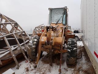 1989 John Deere 444E Front End Wheel Loader w/ John Deere 4276TT018 Diesel And 17.5-25 Tires. Showing 17,905hrs. SN CK444EB000557. *Note: Drive Shaft Missing, Running Condition Unknown, Buyer Responsible For Removal* **Located In Fort McMurray**