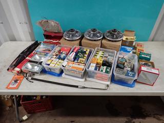 Qty Of (3) Ford Clutch Fans, Light Bulbs, Spark Plugs, Bearings, Valve Stems, Fog Lights, Windshield Wipers, Flares, Gauge And Assorted Supplies **LOCATED IN EDMONTON**
