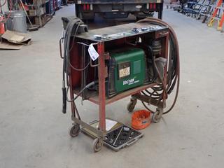 2021 Victor Cut Master 82 208/230/460V Single Or 3 Phase Plasma Cutter c/w 34in X 18in X 38in Portable Steel Workbench w/ 6in Bench Vise, Unused Thermal Dynamics Surelok Circle Cutting Guide And Accessory Pack And Assorted Plasma Consumables