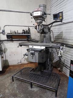 1996 Kent Industrial KTM-3VKH 220V 3-Phase Manual Knee Milling Machine w/ Automatic X-Axis Feed, Anilam Wizard 411 X,Y,Z Digital Readout, R8 Spindle And 8in Riser Block. SN 856483