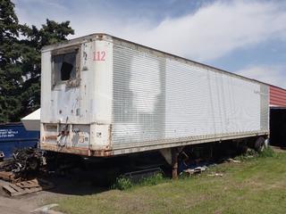Trailmobile T/A 42ft Van Body Trailer c/w 11R24.5 Tires. VIN T90988 *Note: All Front Axle Tires Unattached, Brakes Released, Contents Not Included*.  