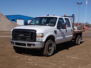 2009 Ford F-350 Super Duty XL 4X4 Crew Cab Flat Deck c/w 5.4L, A/T, 10,600lb GVWR, Ventures 9ft X 80in Deck And LT265/70R17 Tires. Showing 153,558kms. VIN 1FTWW315X9EA19143 **LOCATED IN COLD LAKE, AB**
