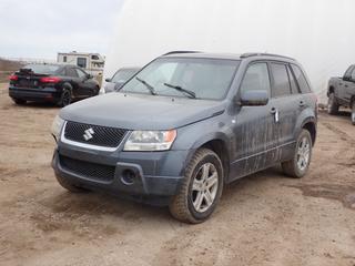 2007 Suzuki Grand Vitara 4X4 SUV c/w 2.7L, V6, A/T, Leather, Power Sunroof And 225/65R17 Tires. Showing 263,428kms. VIN JS3TD947374201070 *Note: Back Tail Light And Fender Damage, Front Bumper Damage, Minor Rust, Engine Light On* **LOCATED AT LOT 2 AB-69, FORT MCMURRAY, AB**