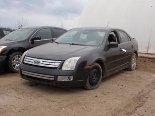 2007 Ford Fusion 4-Door Sedan c/w 3.0L, 4-Cyl  Engine, A/T, Power Sunroof And 225/50R17 Tires. Showing 270,611kms. VIN 3FAHP02137R231673 *Note: Scratches Throughout Body, Dent In Passenger Back Quarter Panel, Engine Light On, Driver Side Window Broken* **LOCATED AT LOT 2 AB-69, FORT MCMURRAY, AB**