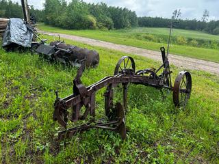 Single Bottom Plow C/w Hyd Raise and Lower And Steel Wheels *Note: Buyer Responsible For Removal* **LOCATED NEAR COLD LAKE, AB FOR MORE INFO CONTACT KIRK @780-826-8558**