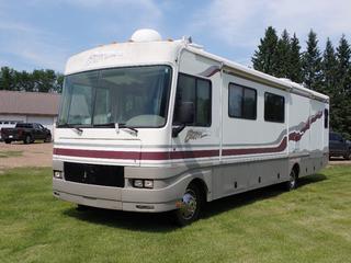 1999 Fleetwood Storm 34ft Motorhome c/w Ford V10 Triton Gas, 20,500lb GVWR, Onan Marquis 5500 5.5kw Generator, (2) Slides, Solar Panel, (2) Satellites, Fridge, Stove, Sleeps 6, Bathroom, (2) Roof Air Conditioners, 10-Gal Hot Water Tank, (4) Hydraulic Jacks, Winterized And 245/70R19.5 Tires. Showing 63,110 Miles. VIN 3FCNF53S3XJA14708 *Note: Rear Ladder Extension Under Bed* **LOCATED @ EDMONTON YARD**