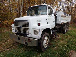 1992 Ford L8000 T/A Dump Truck c/w Ford 7.8L Diesel, A/T, 15ft Box, 52,000lb GVWR And 11R22.5 Tires. Showing 310,874kms. VIN 1FDYW82A2NVA29494 *Note: Tailgate To Be Installed Later, Dent In Roof, Windshield And Hood Cracked* **Located Near Redwater, AB**