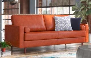 Bombay Leather Sofa, Caramel. Rip at the back