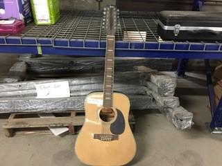 Saga 12 String Guitar. Note:  Broken String.