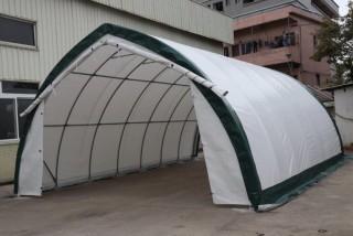 Unused 20'x30'x12' Peak Ceiling Storage Shelter c/w Commercial Fabric, Roll Up Door. 