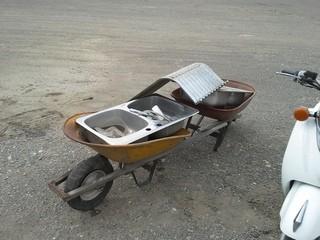 Lot of (2) Wheel Barrow,(2)  40" Window Wells, (2) Kitchen Sinks. 