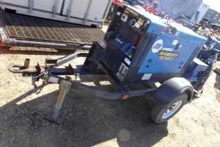 Miller Big Blue 300 Welder / Generator S/N LH210117E, No Hours, Perkins 3 Cylinder Diesel c/w S/A trailer, pintle hitch , storage box (no battery)