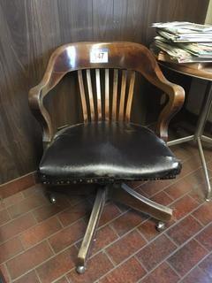 Vintage Rolling Wooden Arm Chair c/w Black Seat. 