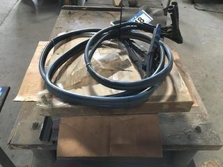 Large U-Bolts, Seal Tape, Booster Cables. 