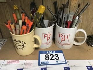 Quantity of Coffee Cups With Mini Blade Screw Drivers, Pens And Pins.