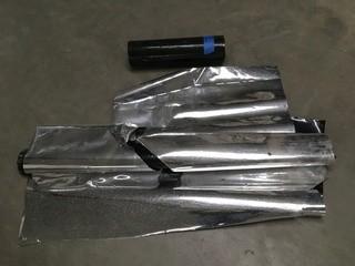 (1) Roll of Black Plastic & (2) Pieces of Reflective Plastic. 