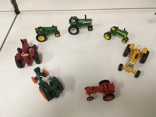 Lot of (7) Assorted Mini Diecast Tractors.