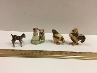 Lot of (4) Porcelain Figurines.