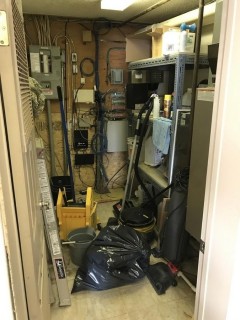 Contents of Furnace Room including 1 section of Shelving, Vacuum, Ladder, Mop and Bucket.