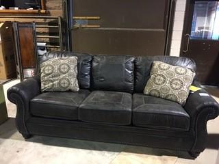 Benchcraft Leather-Look Upholstered Sofa.