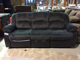 Brown Bonded Leather & Microsuede Reclining Sofa.